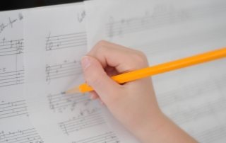 Student hand composing_Larger